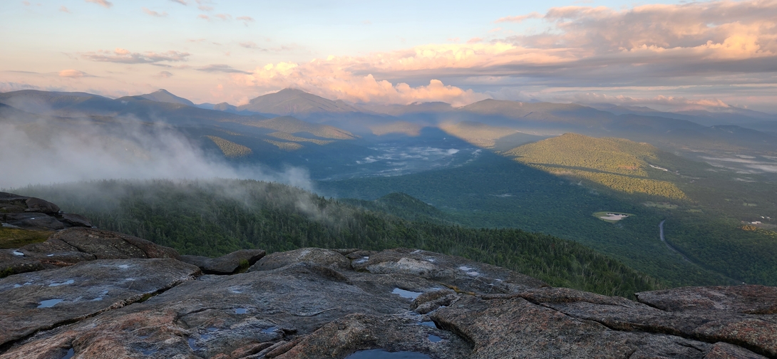 Wind-driven mist rises from the forest and spills over a mountain ridge near Cascade’s summit.