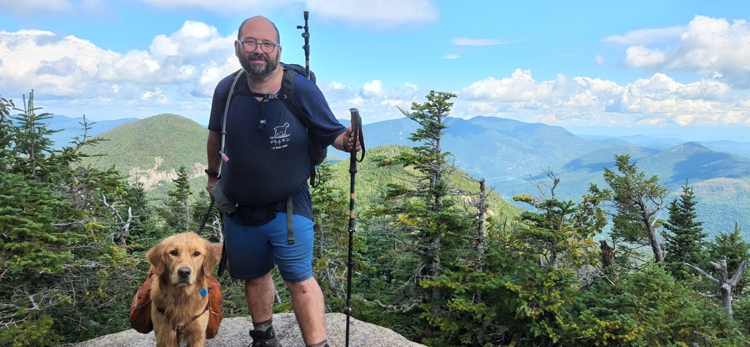 Adam and Sunny pose together at the Upper Wolfjaw summit viewpoint.