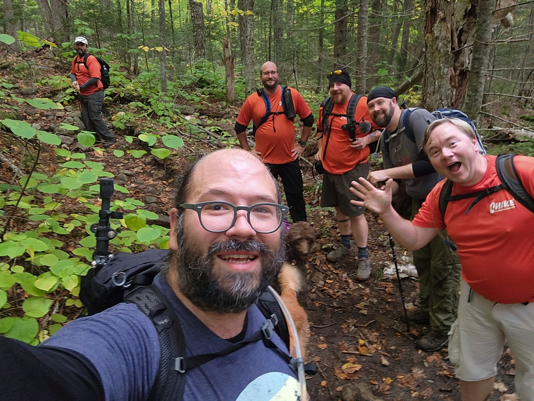 Adam takes a cheerful group selfie with the hikers setting out for Dix Mountain.