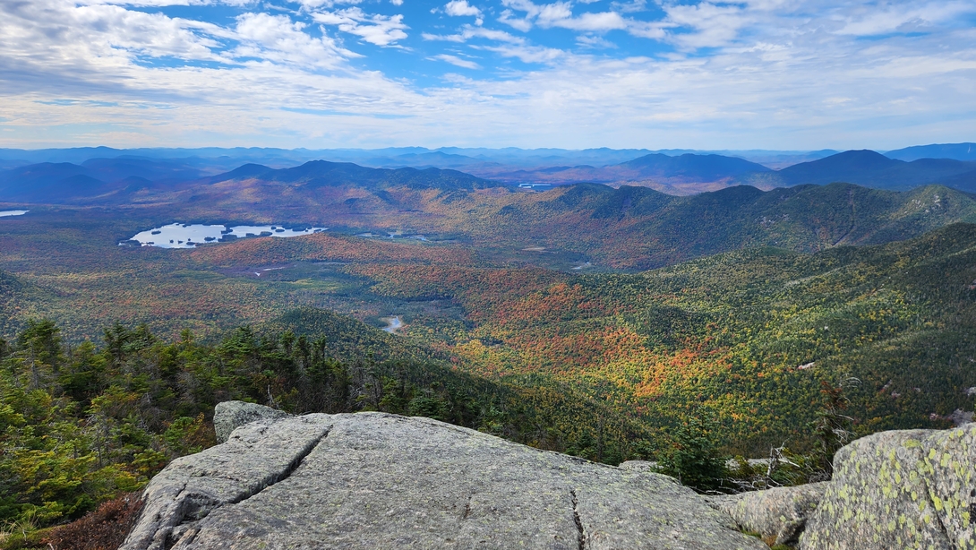 The Colvin Range stretches across the colorful autumn landscape below Dix Mountain.