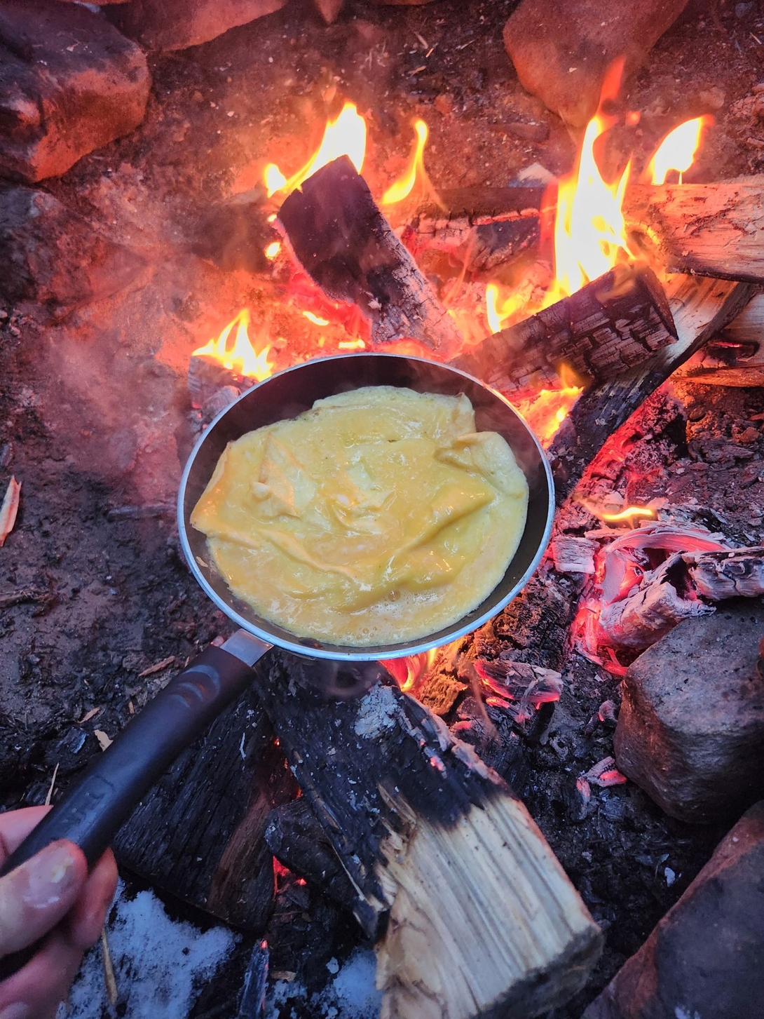 Eggs! The butane stove was not having it. Hot coals did nicely.